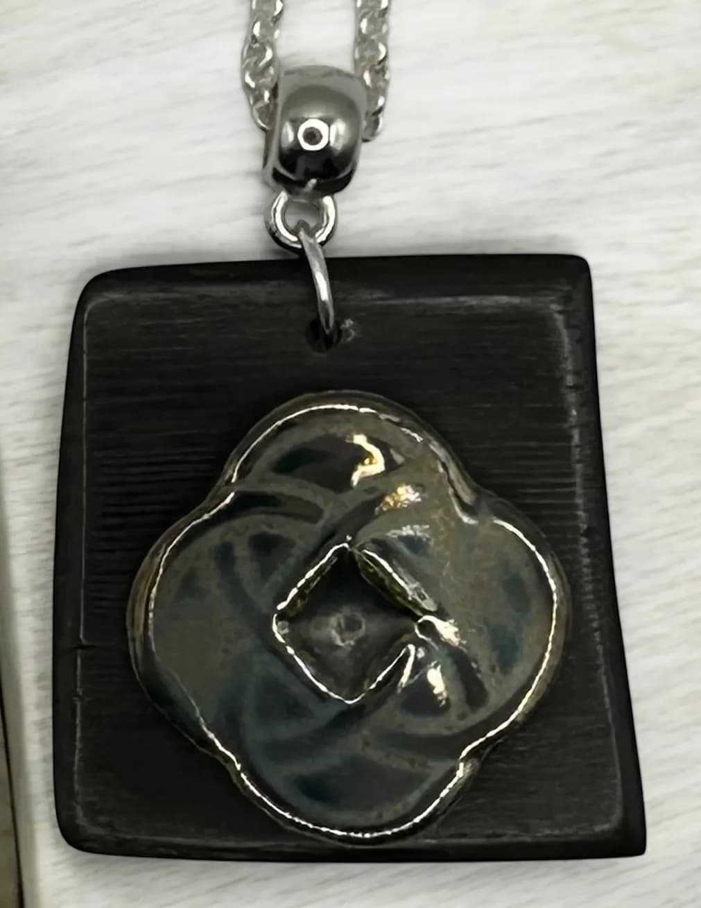 Elegant Black and Silver Floral Pendant: A Unique Statement Piece for Any Occasion