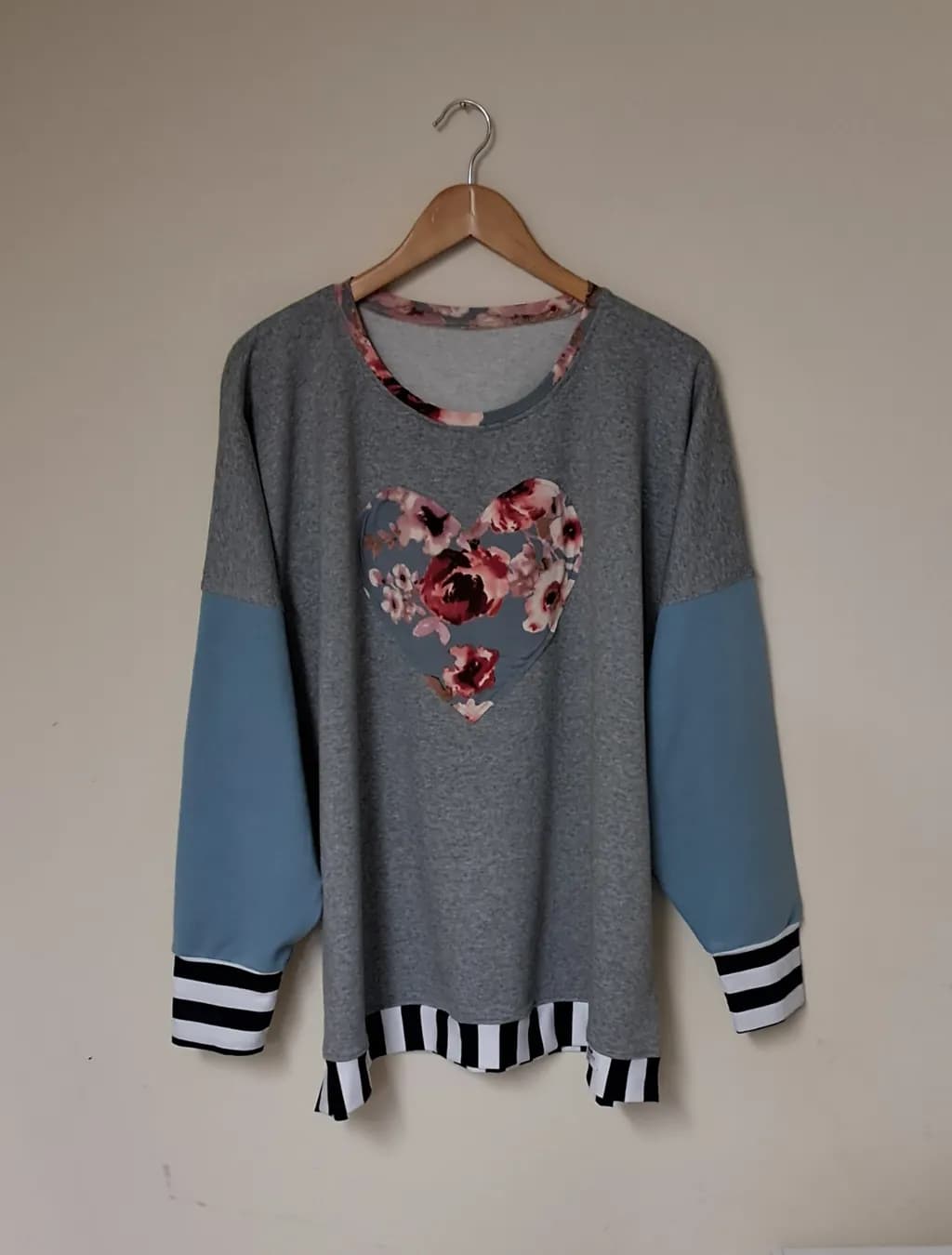 Floral Heartbeat: Cozy Grey Sweatshirt with Striped Accents