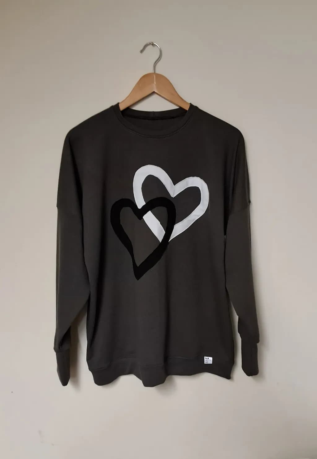 Heartfelt Harmony: Embrace Love with Our Artistic Two-Tone Sweatshirt