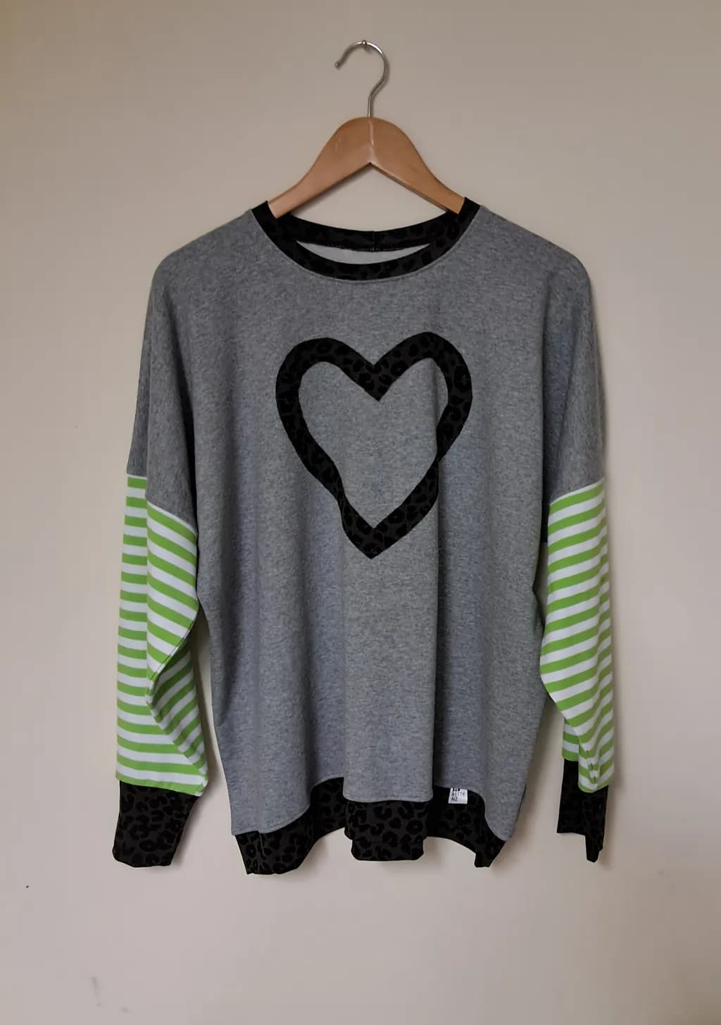 Heartfelt Harmony: A Playful Blend of Gray, Stripes, and Leopard Print Sweatshirt