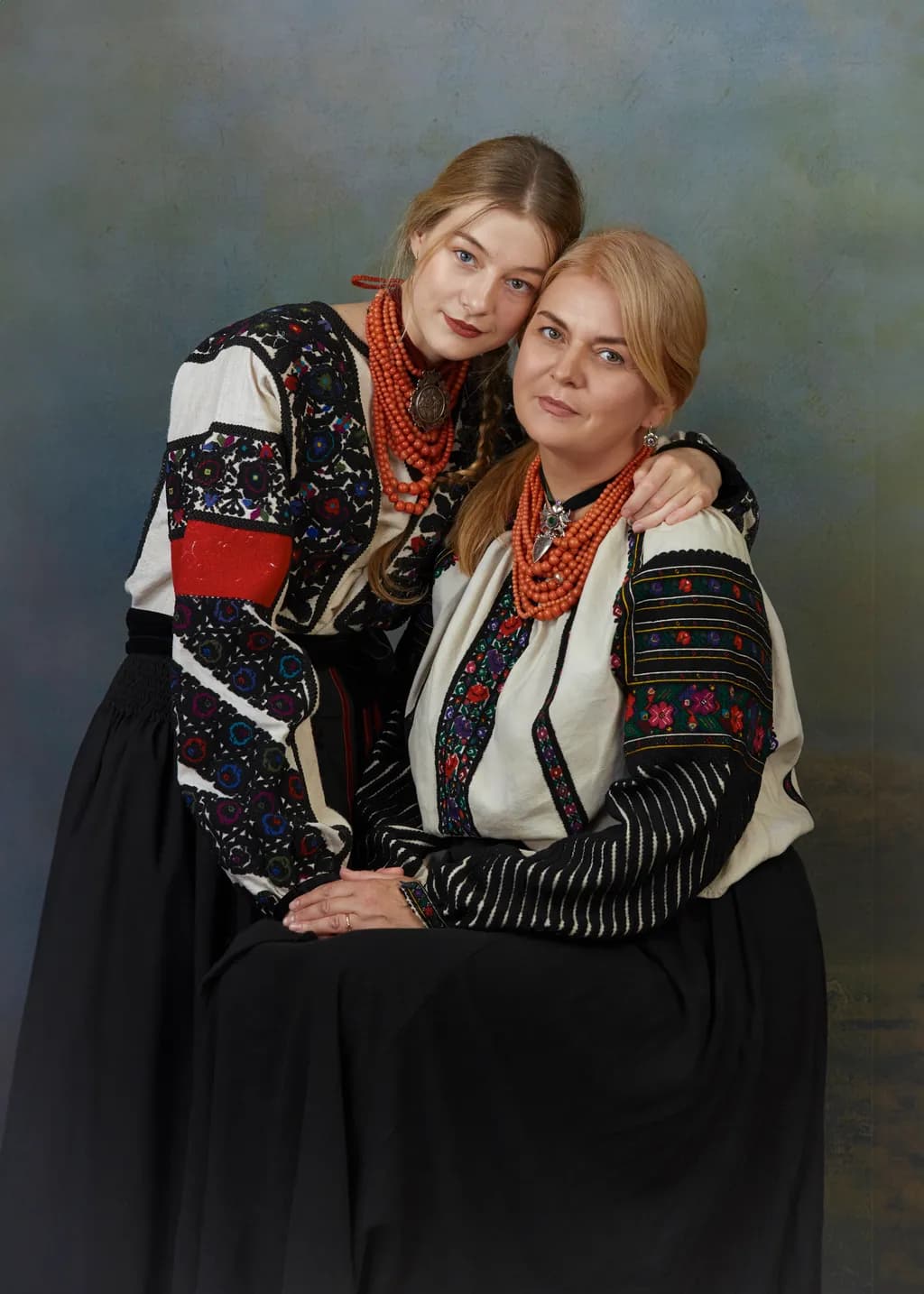 Heritage Embrace: A Portrait of Generational Connection in Traditional Attire