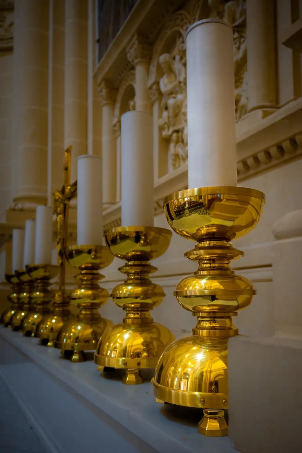 Golden Serenity: A Captivating Display of Candle Holders in Sacred Space