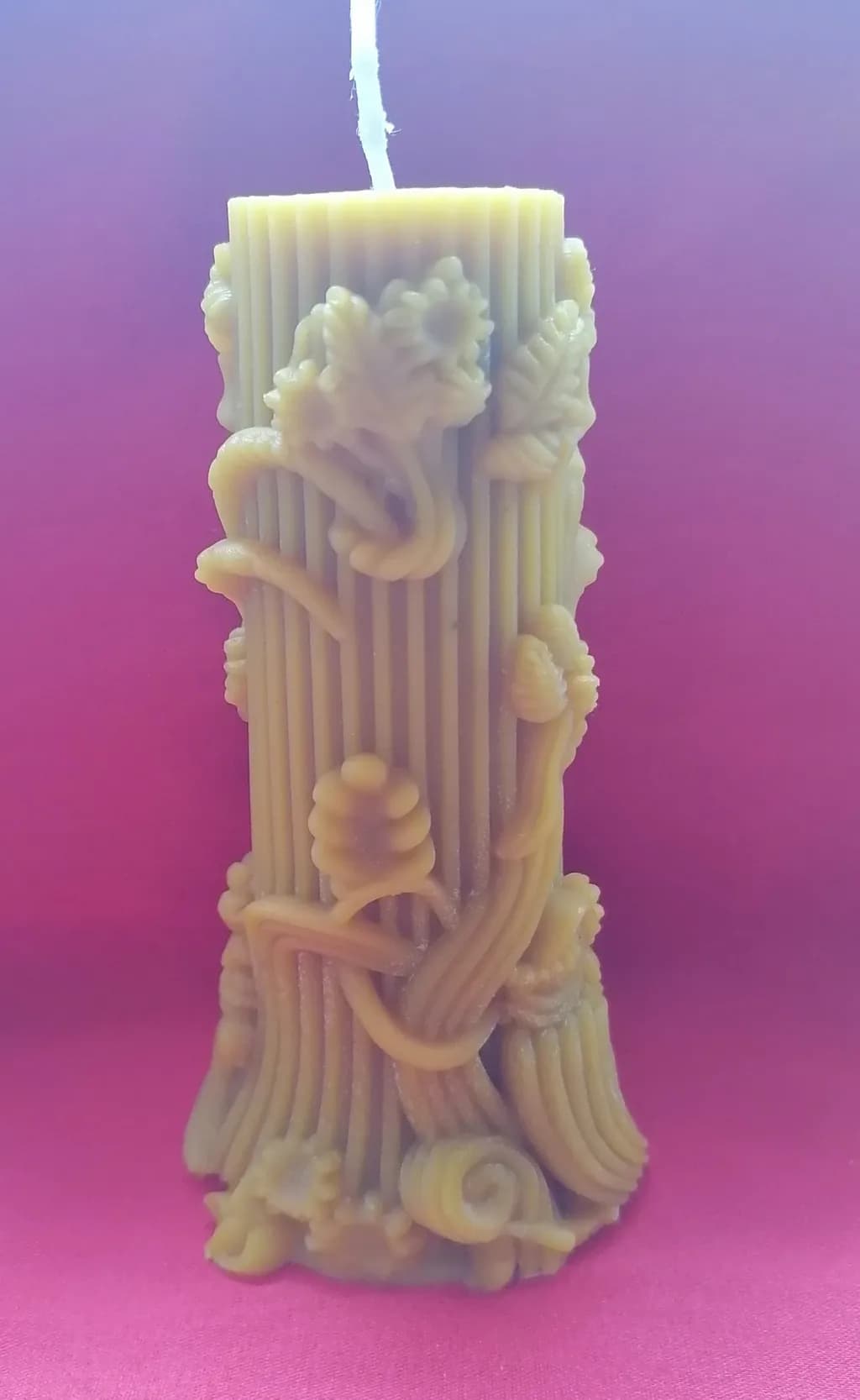 Floral Harmony: Handcrafted Beeswax Candle with Decorative Vines and Blossoms