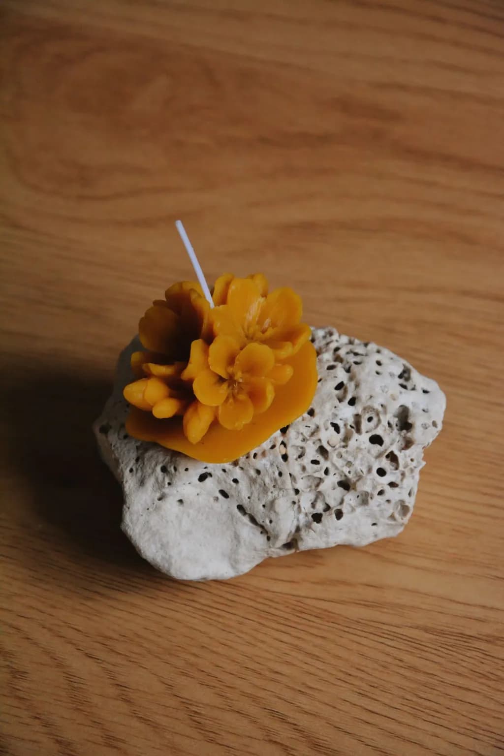 Golden Blossom Candle on Natural Stone Base