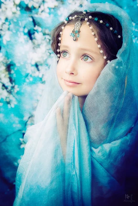 Whispers of Innocence: A Serene Portrait in Ethereal Blue Tones