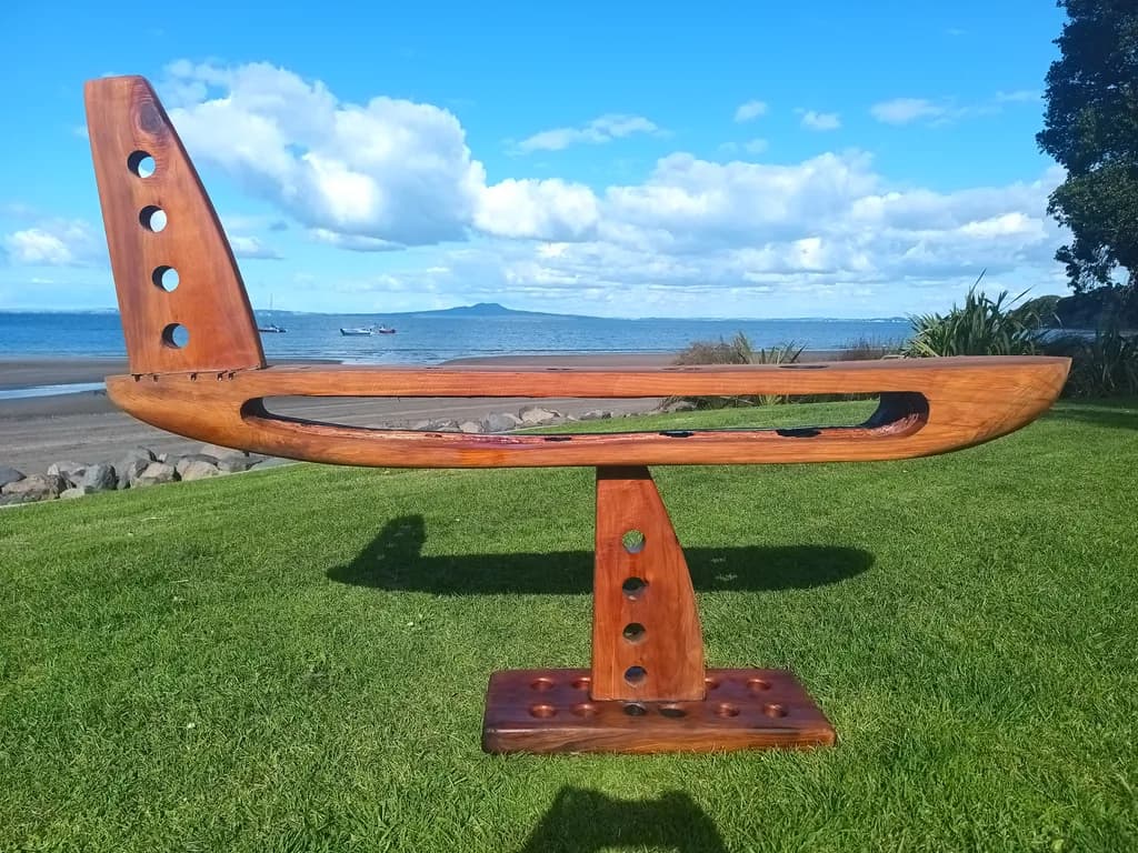 Sculptural Elegance: A Contemporary Wooden Boat-Inspired Art Piece for Coastal Living