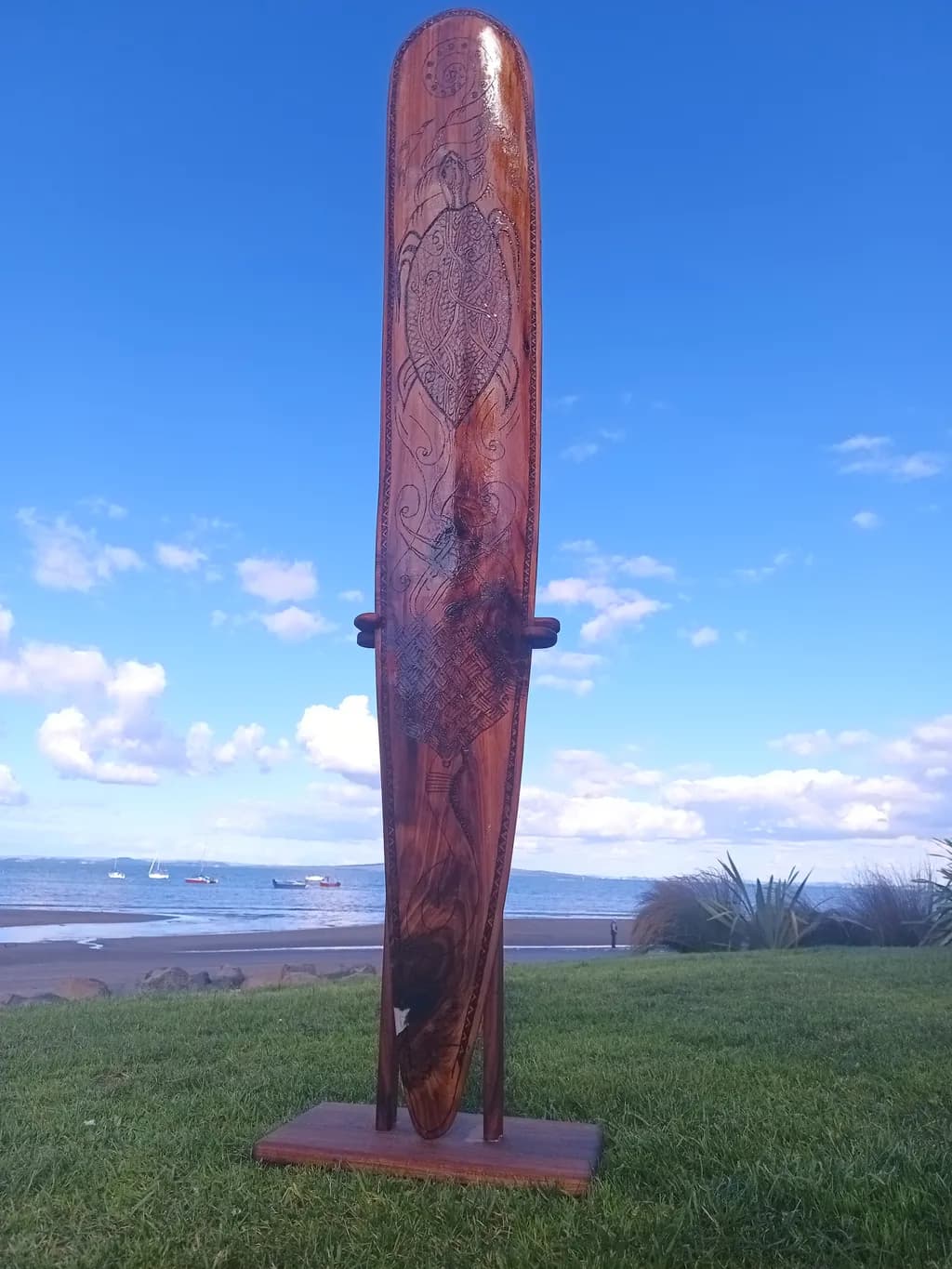 Ocean's Embrace: Handcrafted Wooden Paddle with Intricate Turtle Design