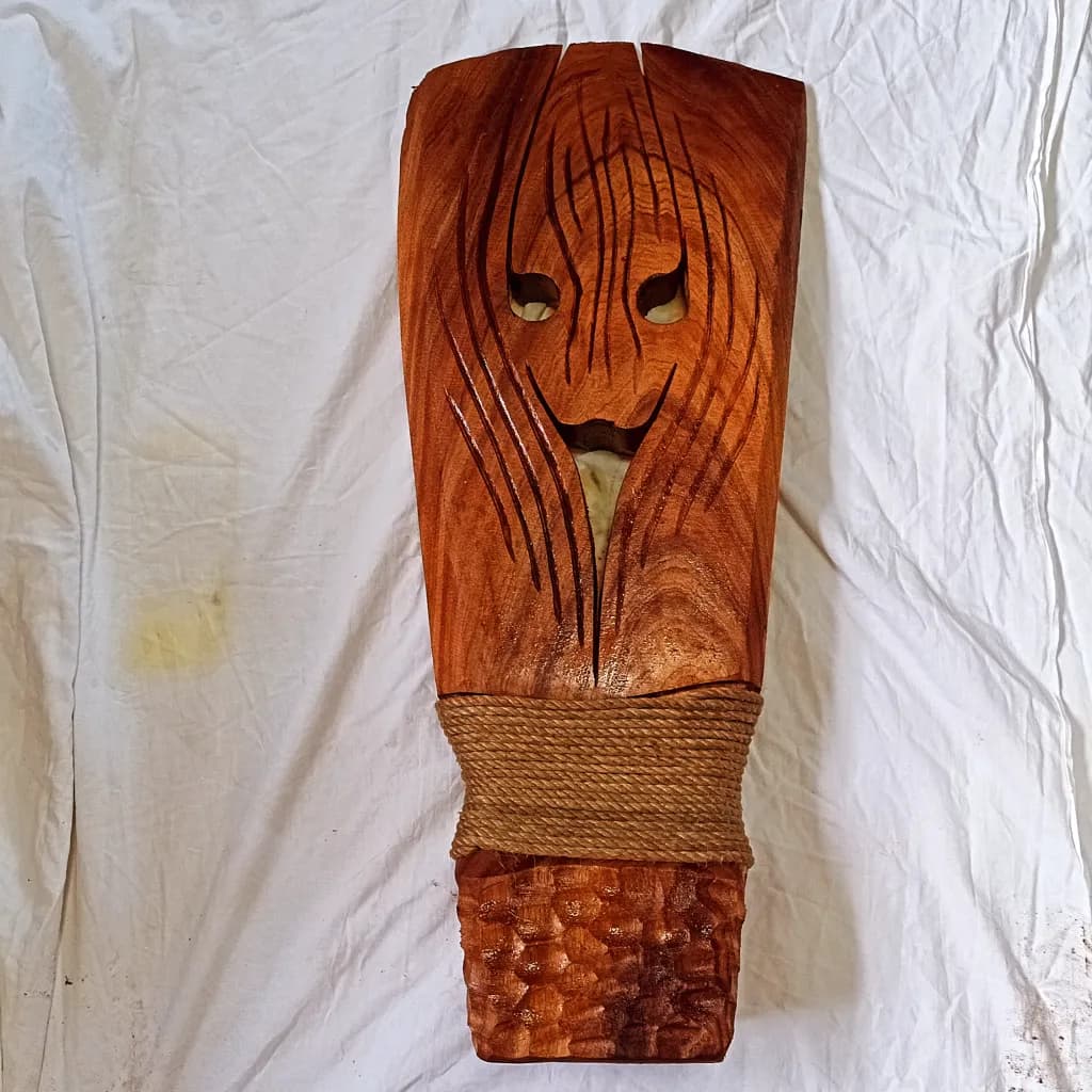 Whispers of the Forest: Hand-Carved Wooden Mask with Natural Elegance