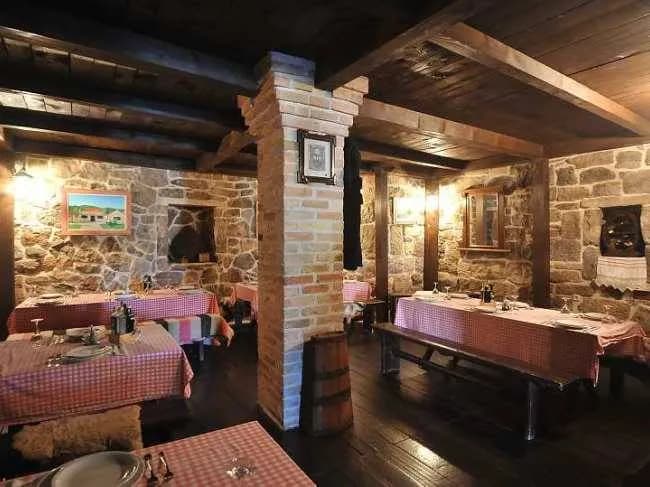 Rustic Charm: A Cozy Dining Experience in a Stone-Walled Haven