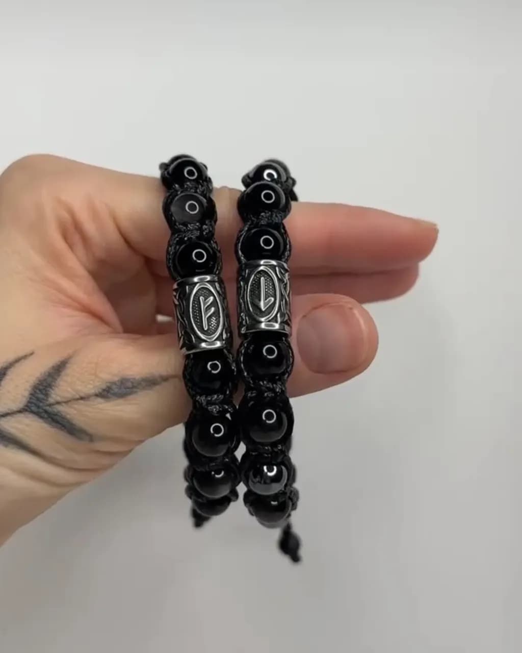 Elegant Black Beaded Bracelets with Intricate Silver Accents for a Bold Statement