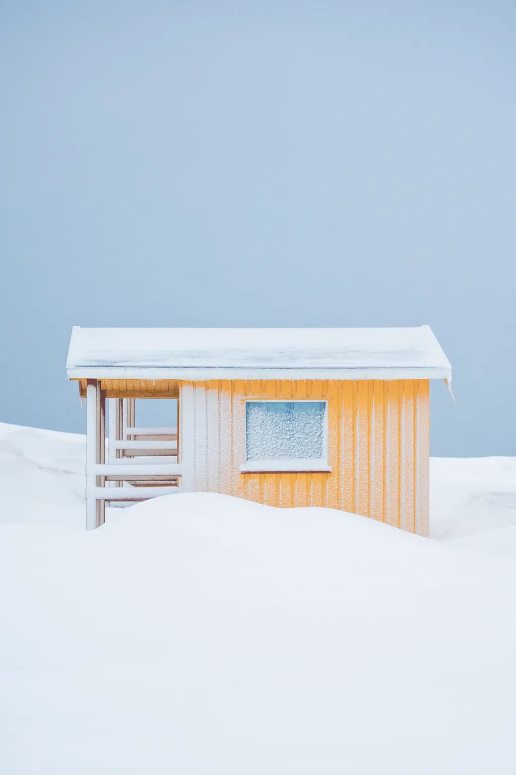 Whispers of Winter: A Solitary Cabin Embraced by Snow's Silence