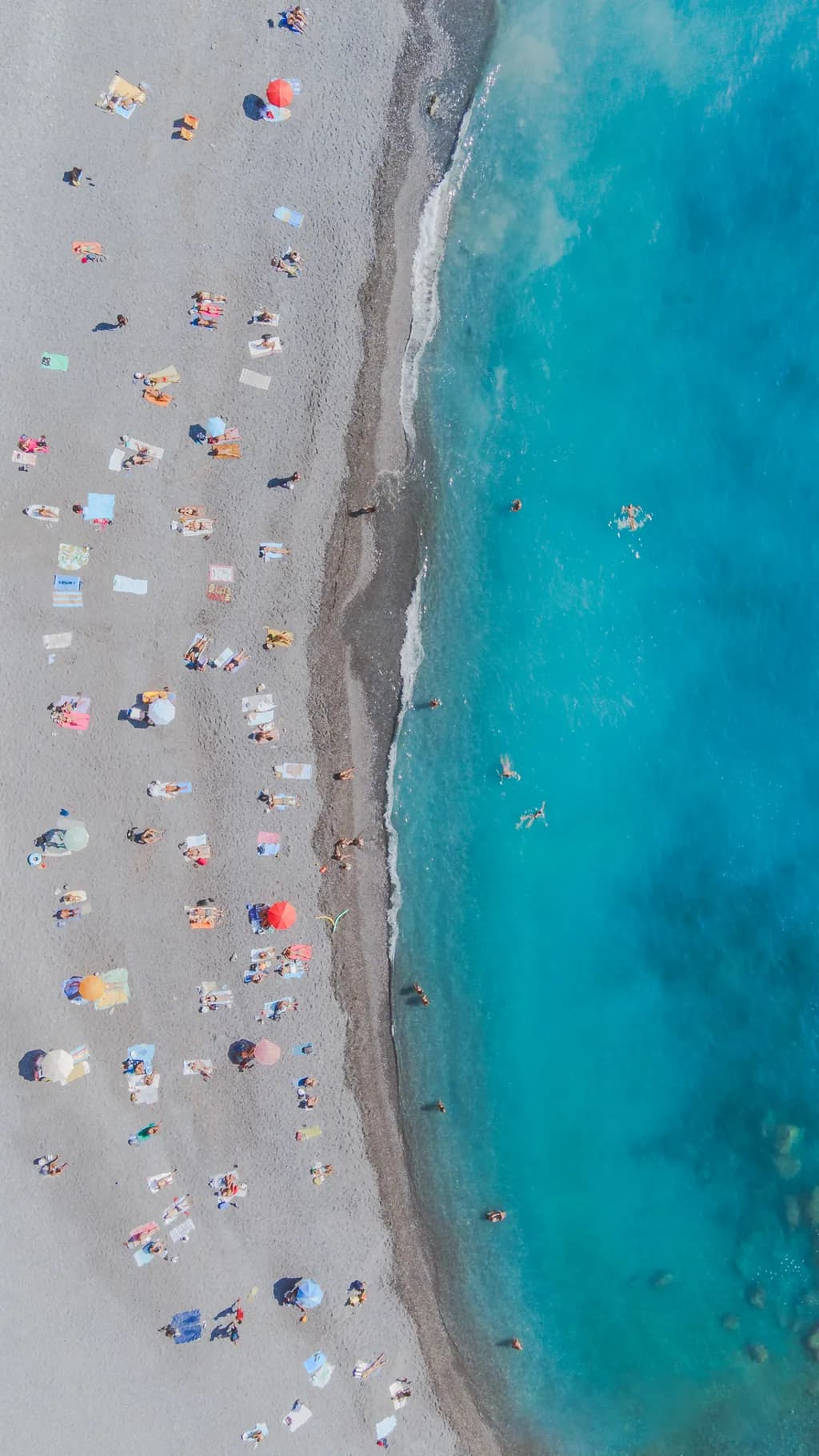Serenity by the Shore: A Vibrant Aerial View of Beach Life and Relaxation