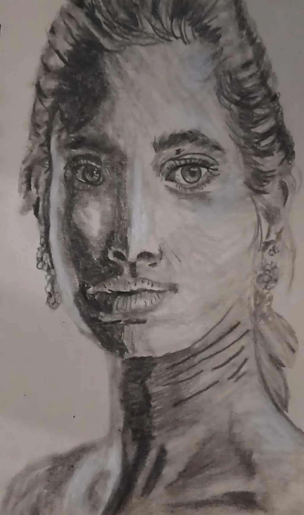 Ethereal Gaze: A Charcoal Portrait of Strength and Grace