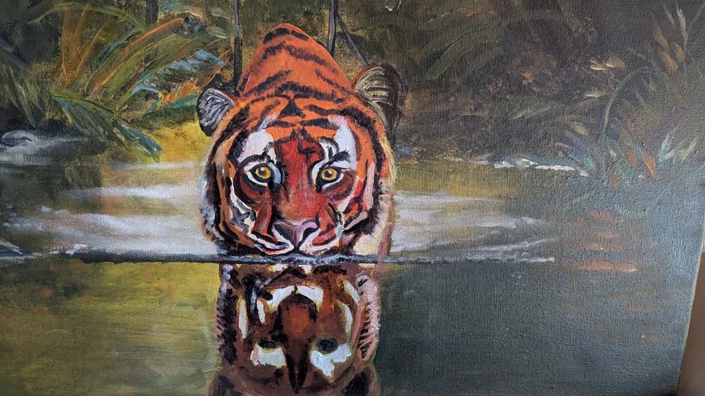 Vibrant Reflections: The Majestic Tiger in a Forest Oasis
