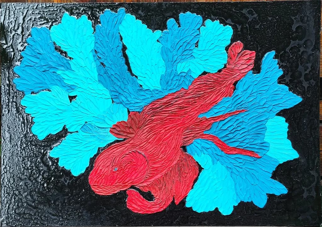 Vibrant Harmony: A Red Fish Amidst Lush Blue Coral Textures