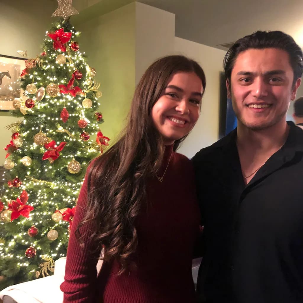 Joyful Moments by the Christmas Tree: A Celebration of Togetherness and Holiday Spirit