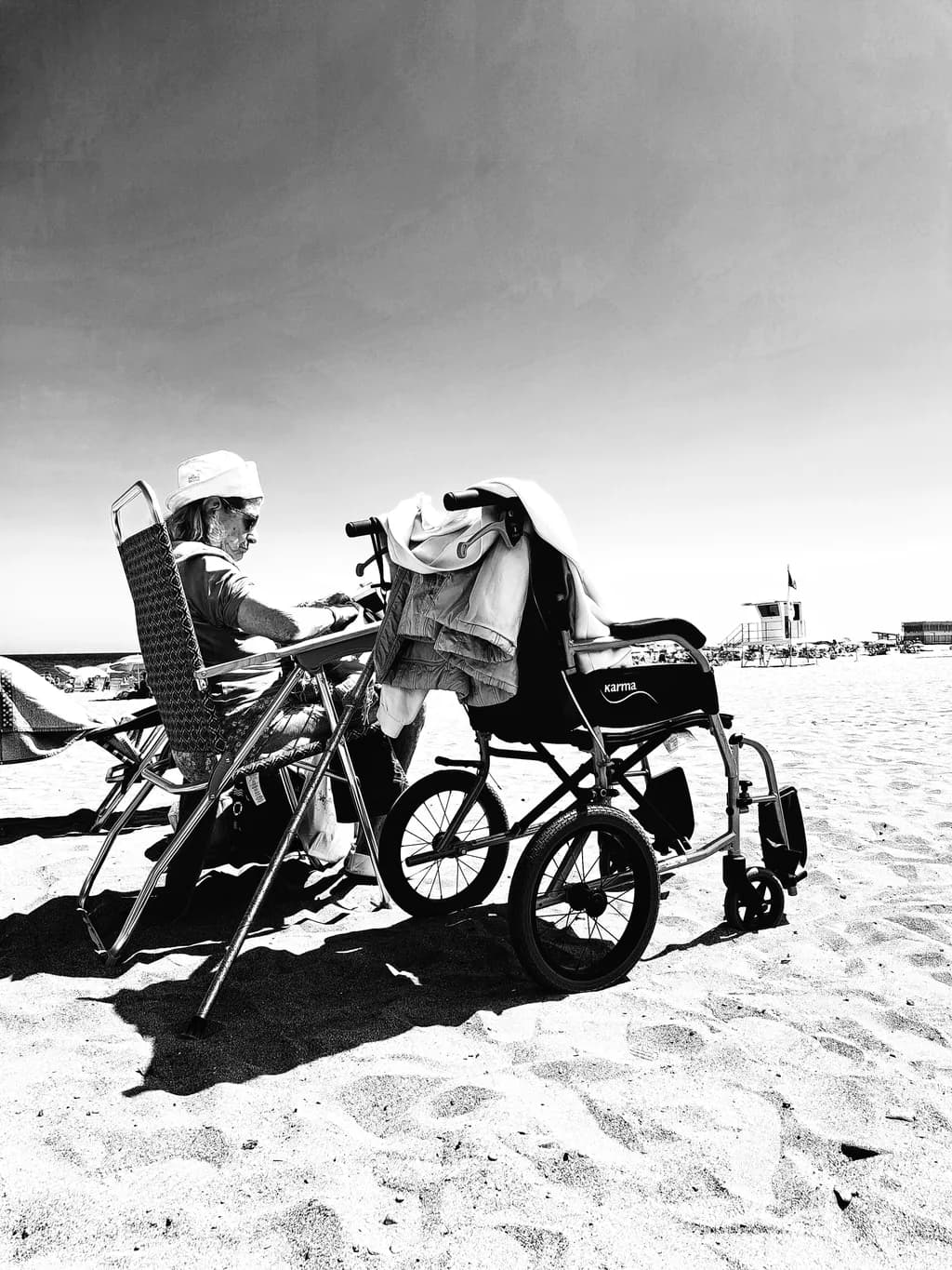Serenity in Black and White: A Beachside Reflection on Relaxation and Resilience