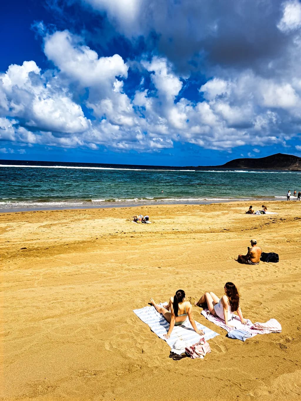 Serenity by the Shore: Embracing Sunshine and Clouds on a Tranquil Beach Day
