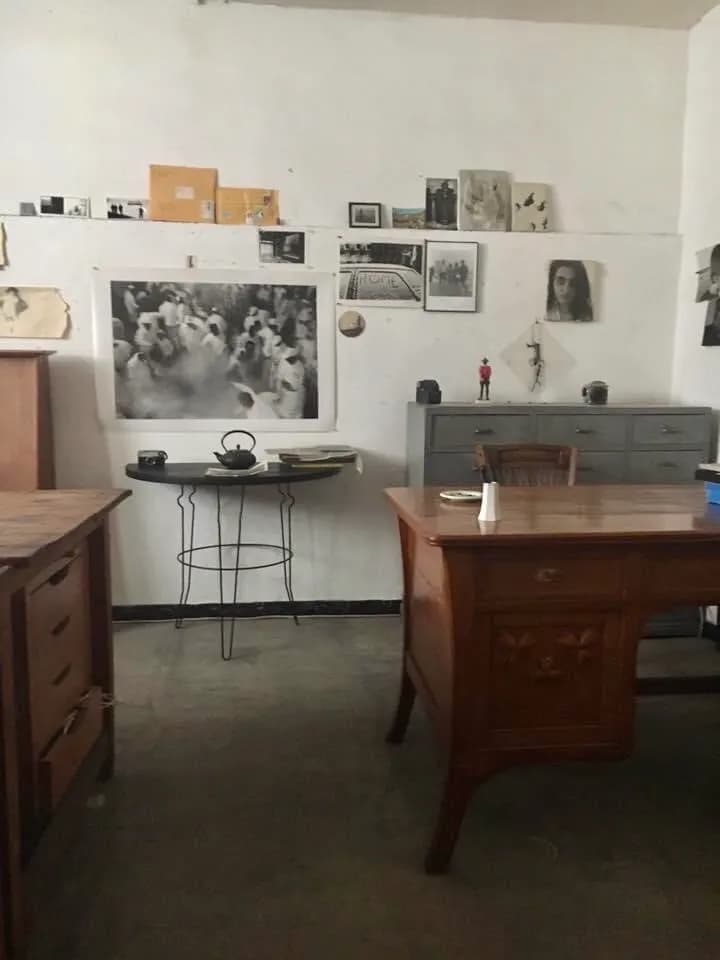 Nostalgic Workspace: A Captivating Blend of Wooden Decor and Timeless Photography
