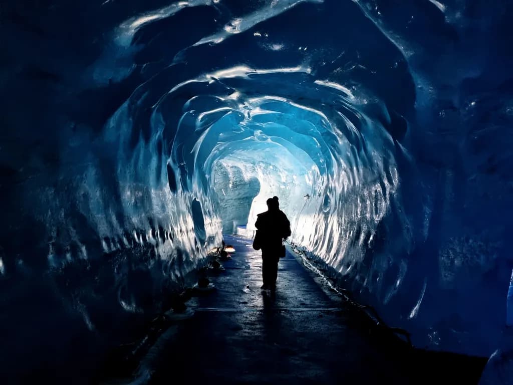 Frozen Pathways: A Journey Through the Ice Cave's Ethereal Glow