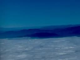 Mountain Ridges Above Clouds