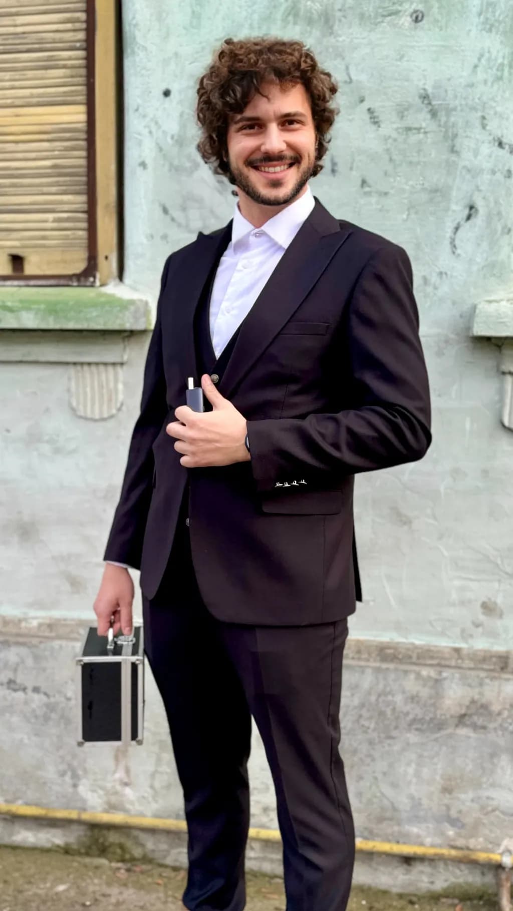 Urban Elegance: A Confident Smile in a Stylish Suit