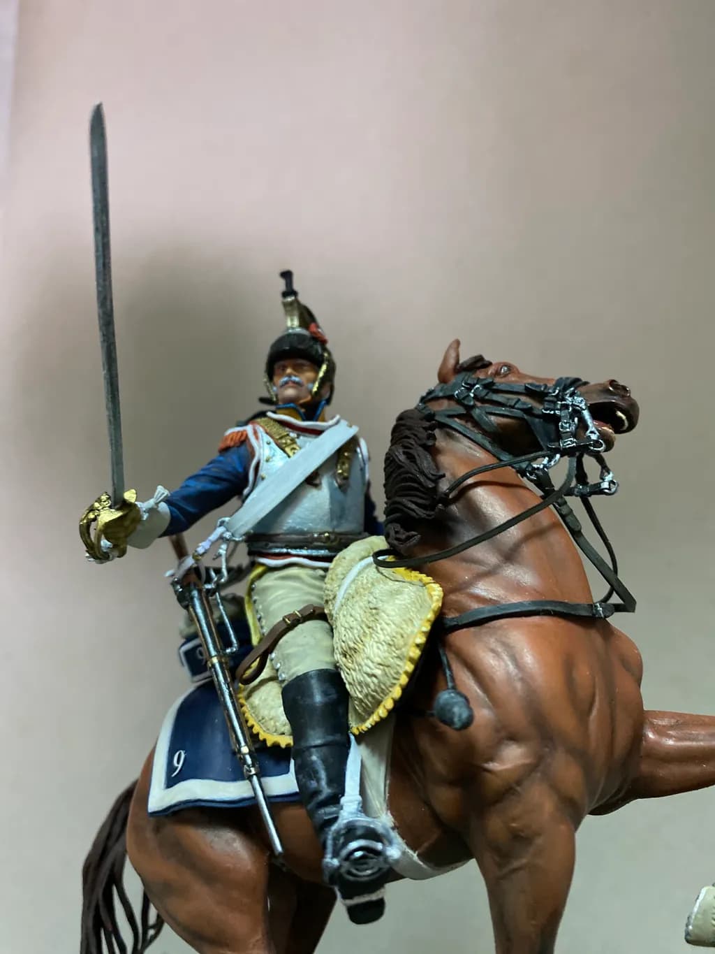 Majestic Charge: A Soldier on Horseback in Full Uniform with Sword Raised