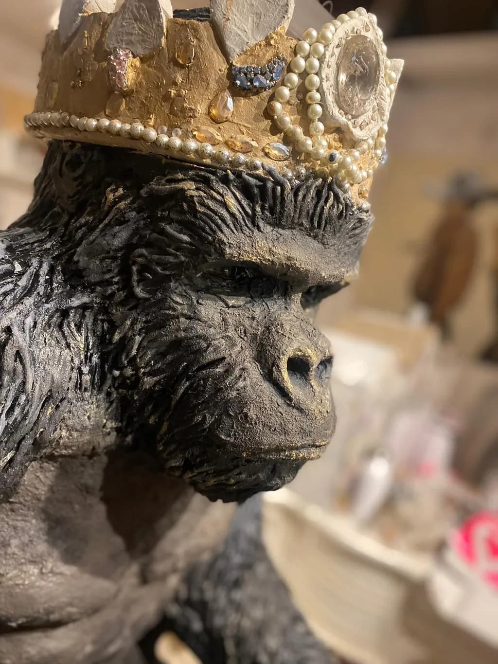 Regal Majesty: The Crowned Gorilla Sculpture