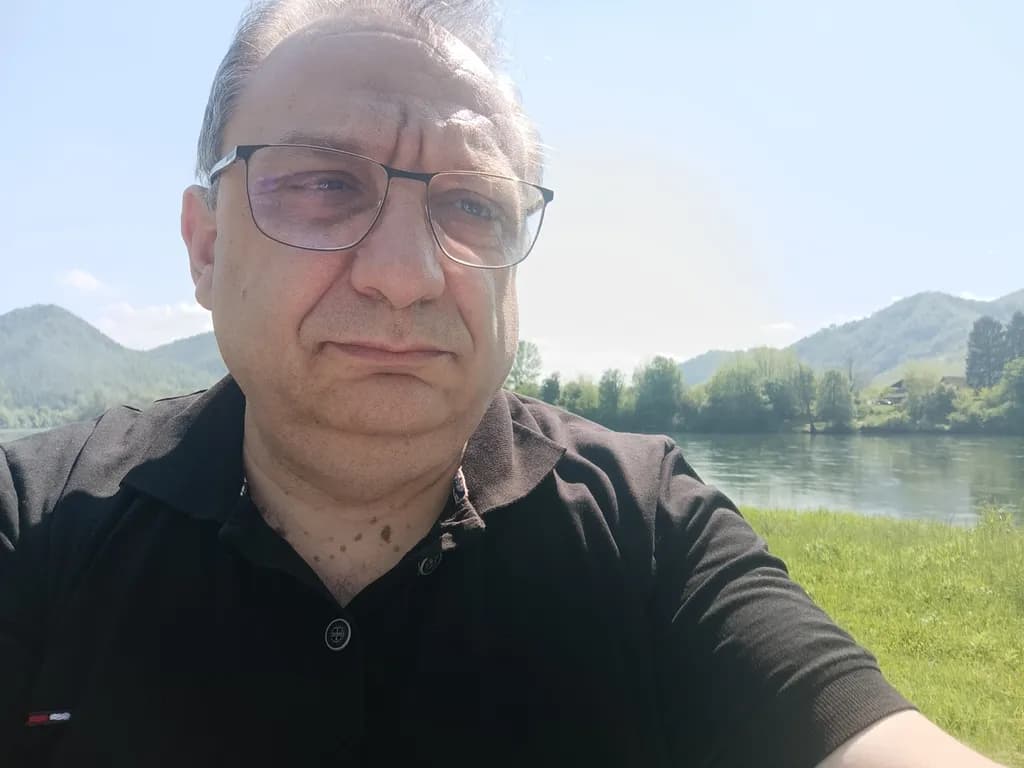 Reflections by the River: A Moment of Contemplation in Nature's Embrace
