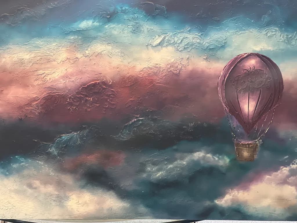 Whimsical Journeys: A Hot Air Balloon's Dance Among Dreamy Clouds