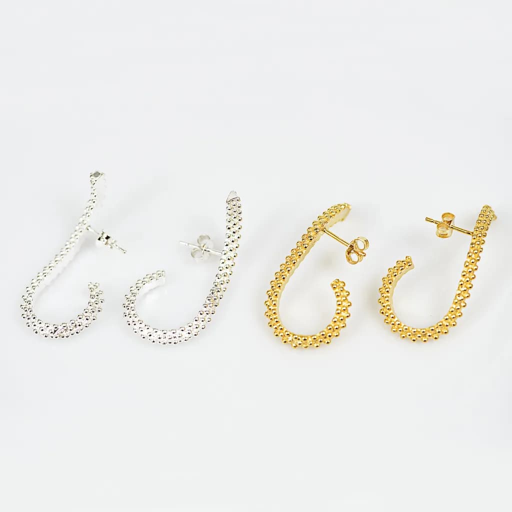 Elegant Curves: Silver and Gold Hoop Earrings for Timeless Fashion Statements