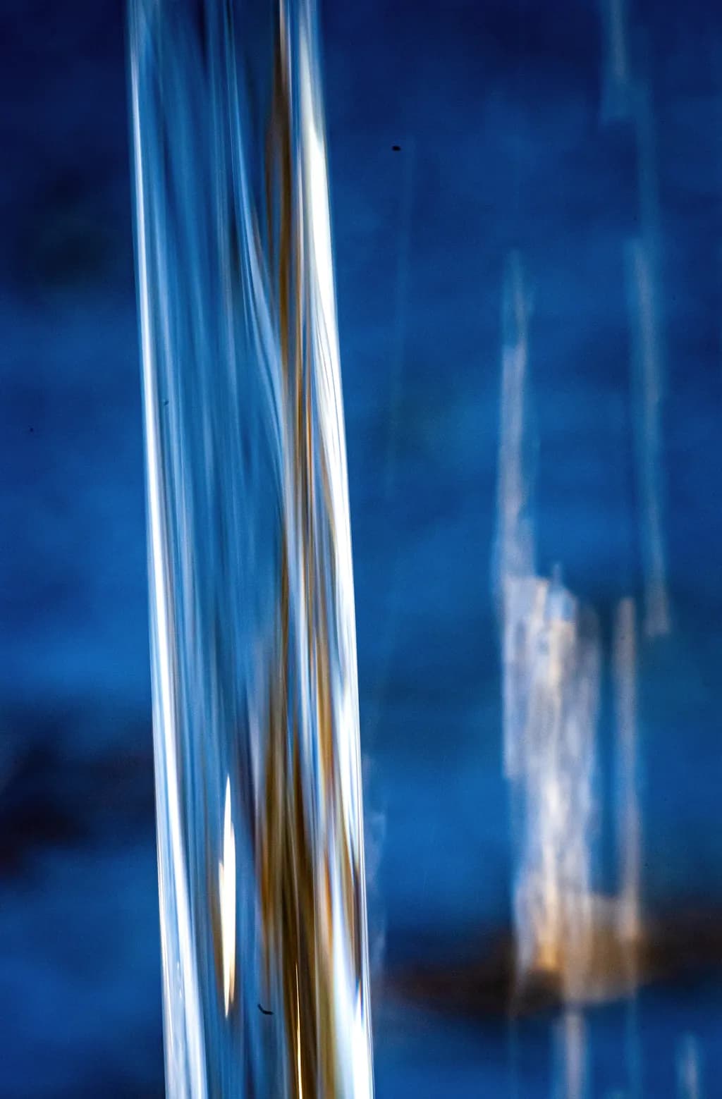 Fluid Reflections: The Dance of Blue Water and Light
