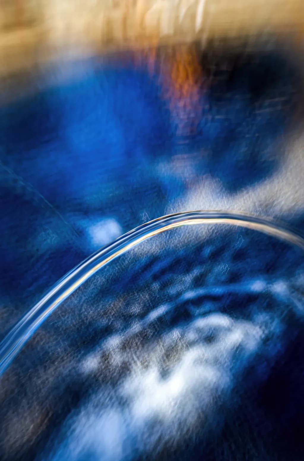 Whispers of Blue: An Abstract Dance of Light and Water