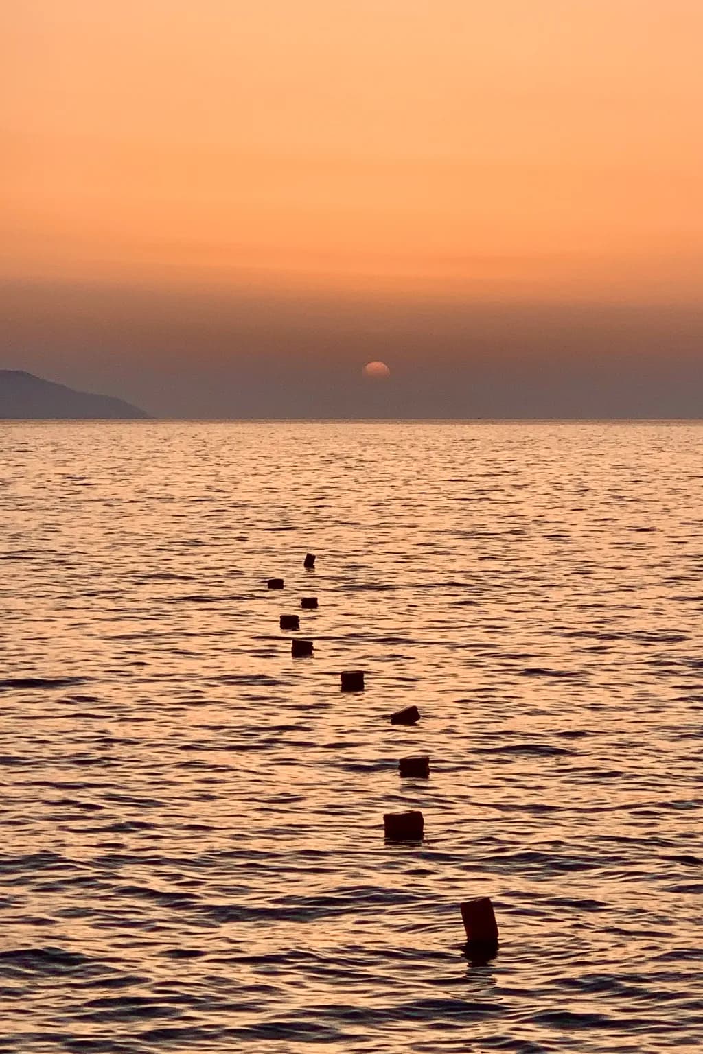 Whispers of Dusk: A Serene Sunset Over Tranquil Waters
