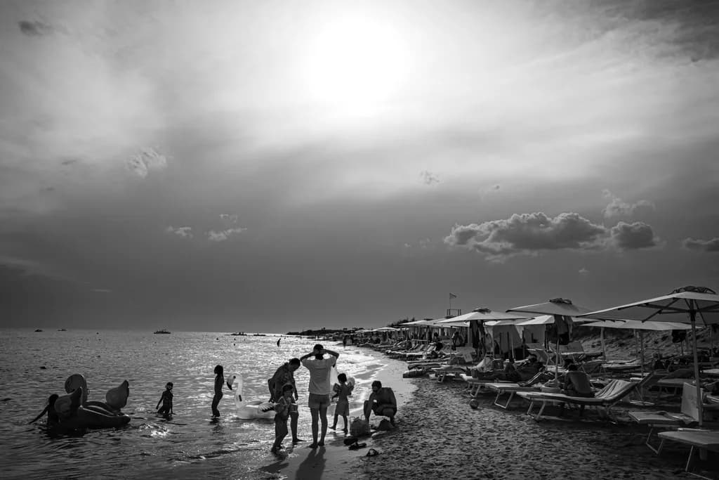 Ethereal Moments: A Family's Day at the Beach in Monochrome Serenity
