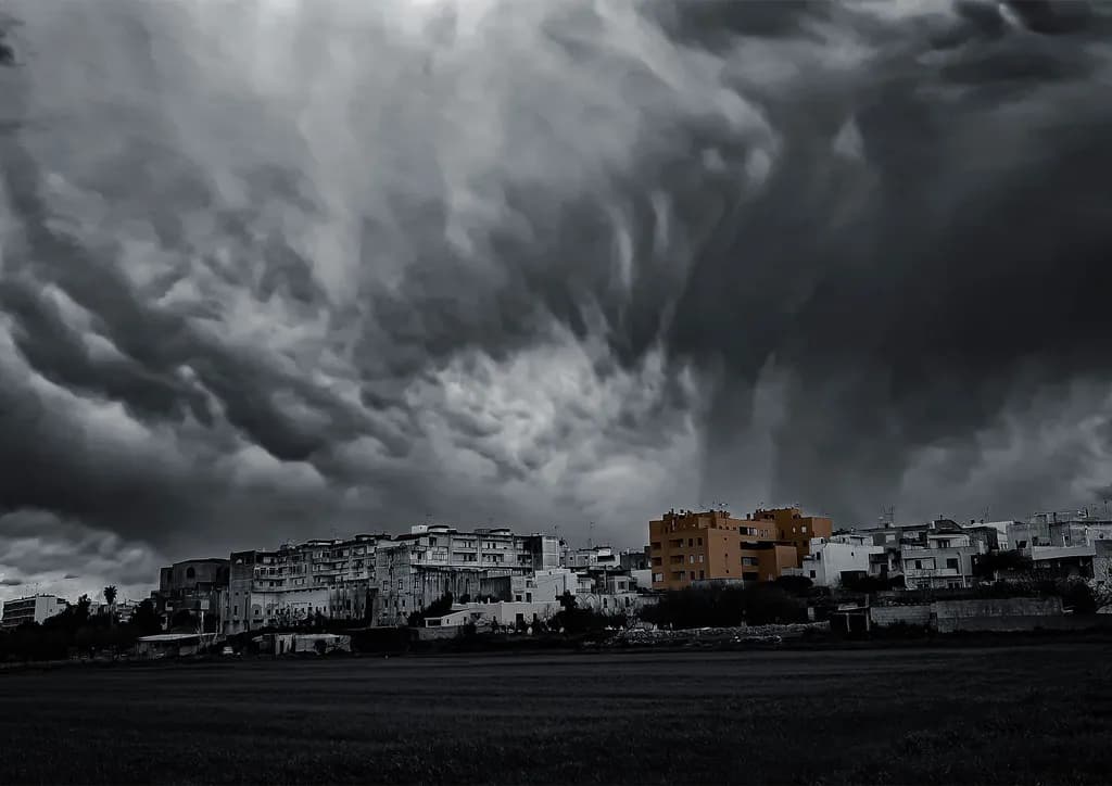 Urban Monochrome: A Dramatic Contrast Beneath Ominous Clouds