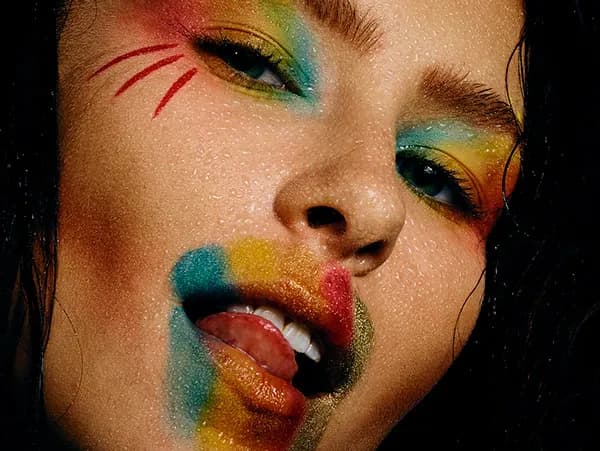 Vibrant Expressions: A Colorful Portrait of Artistic Makeup and Emotion