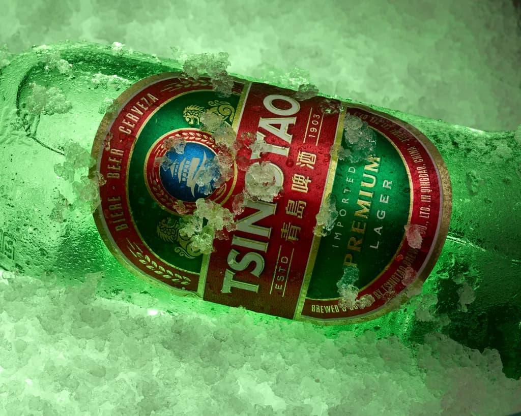 Chilled Elegance: A Tsintao Lager in Icy Embrace
