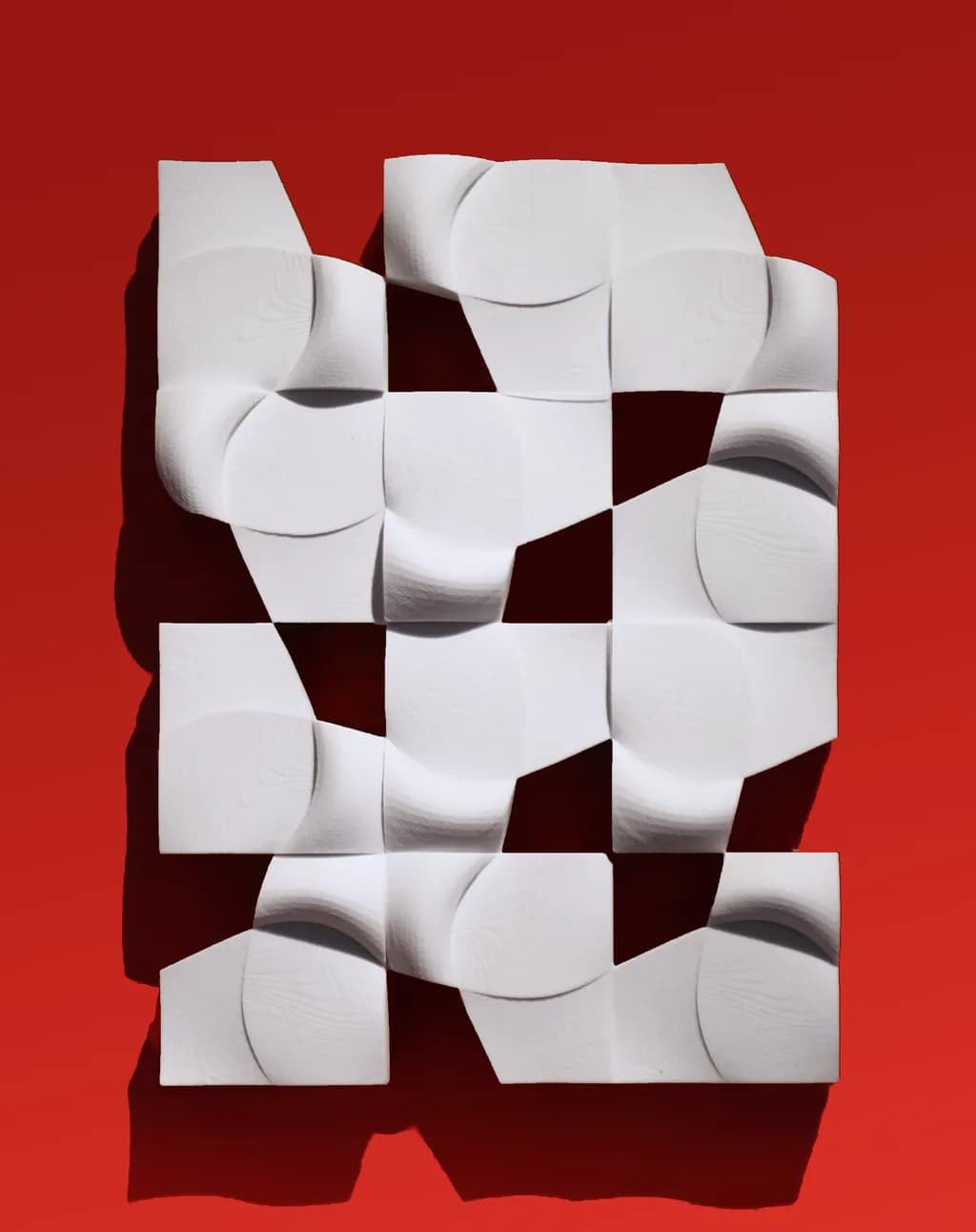Dynamic Geometry: A Play of Shadows and Texture on Bold Red Canvas