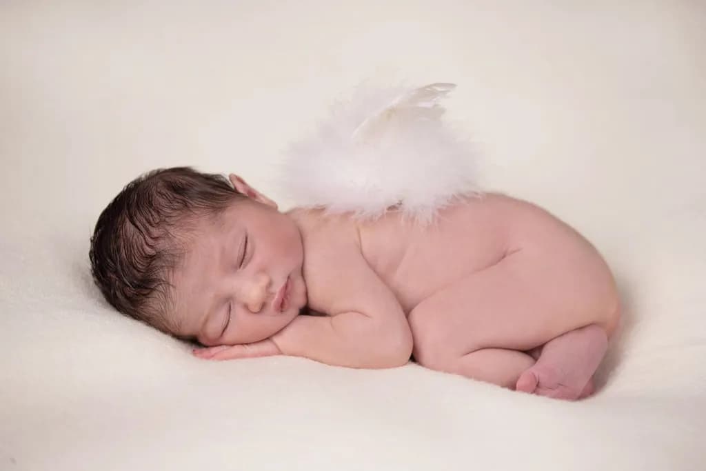 Whispers of Innocence: A Cherubic Newborn's Dreamy Embrace