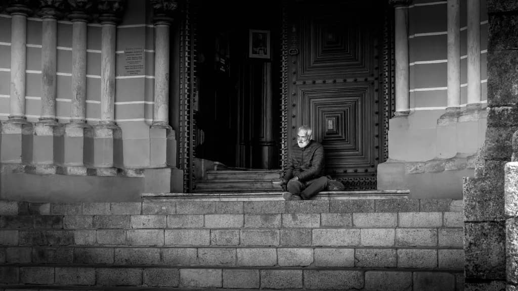 Silent Reflections: A Solitary Moment on the Steps of Time