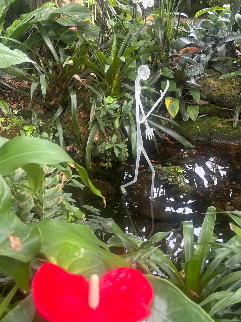 Glass Figure in Garden Pond