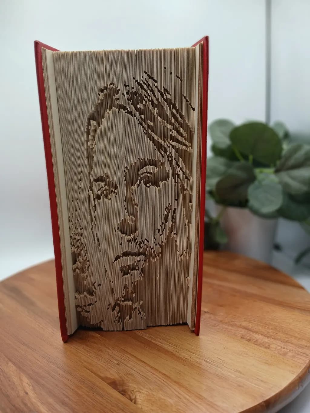 Whispers of the Page: Intricate Book Sculpture Portraiture
