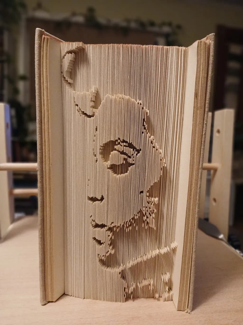 Whispers of Paper: A Sculpted Portrait in Book Art