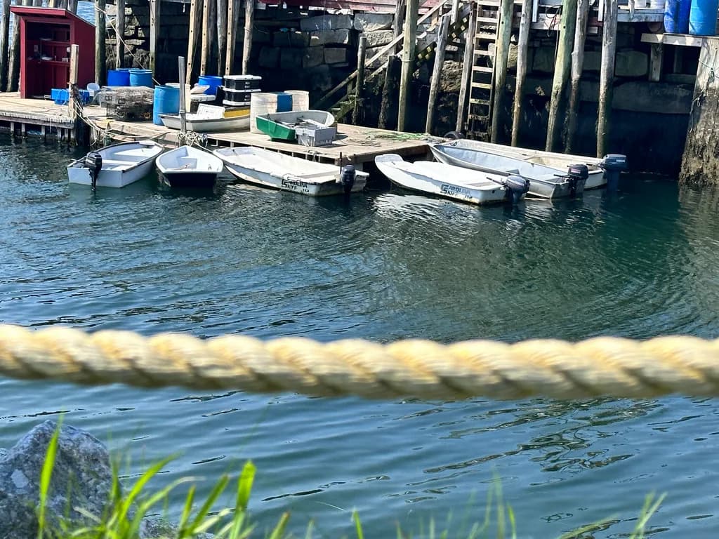 Serenity at the Dock: A Tranquil Moment with Boats and Reflections in Calm Waters