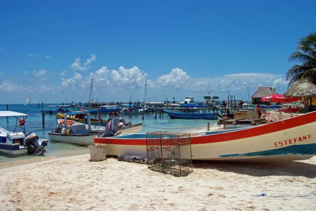 Serenity by the Shore: A Vibrant Coastal Scene with Boats and Blue Skies