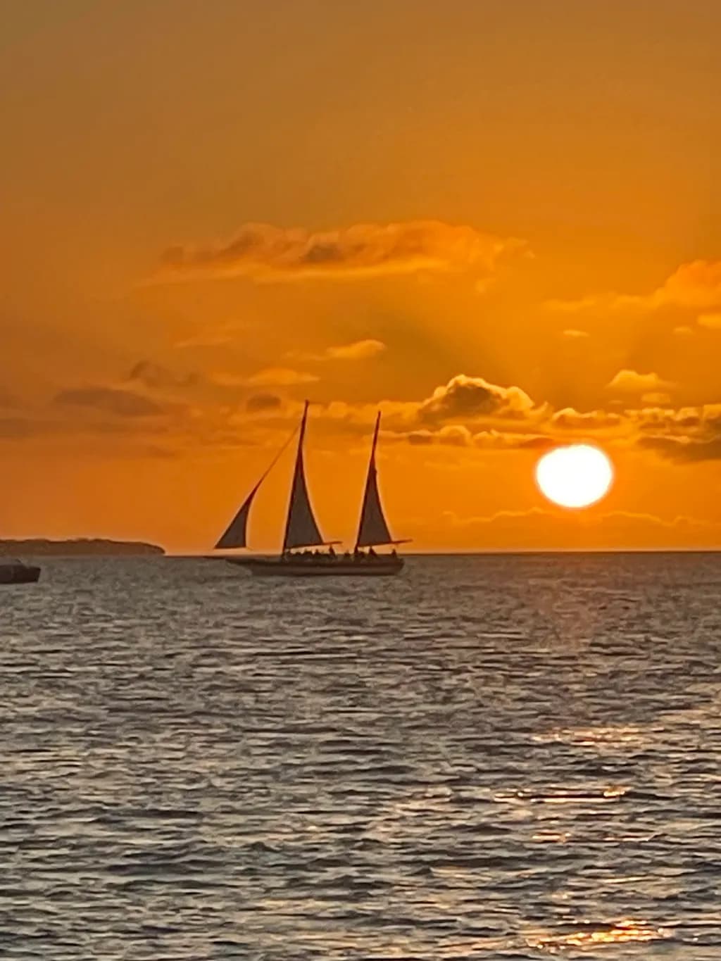 Sailing into the Golden Horizon: A Serene Sunset Voyage