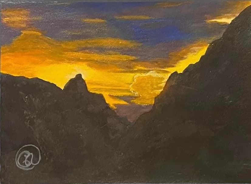 Golden Horizons: A Sunset Embrace Over Majestic Peaks