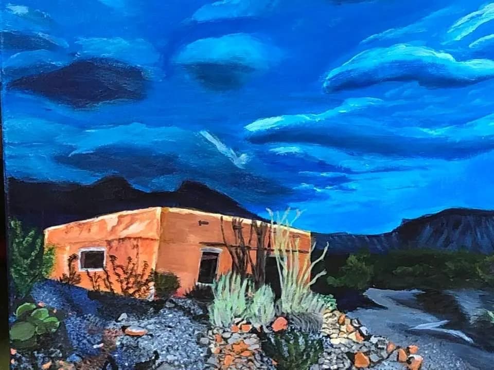 Desert Serenity: A Vibrant Abode Under a Dramatic Sky