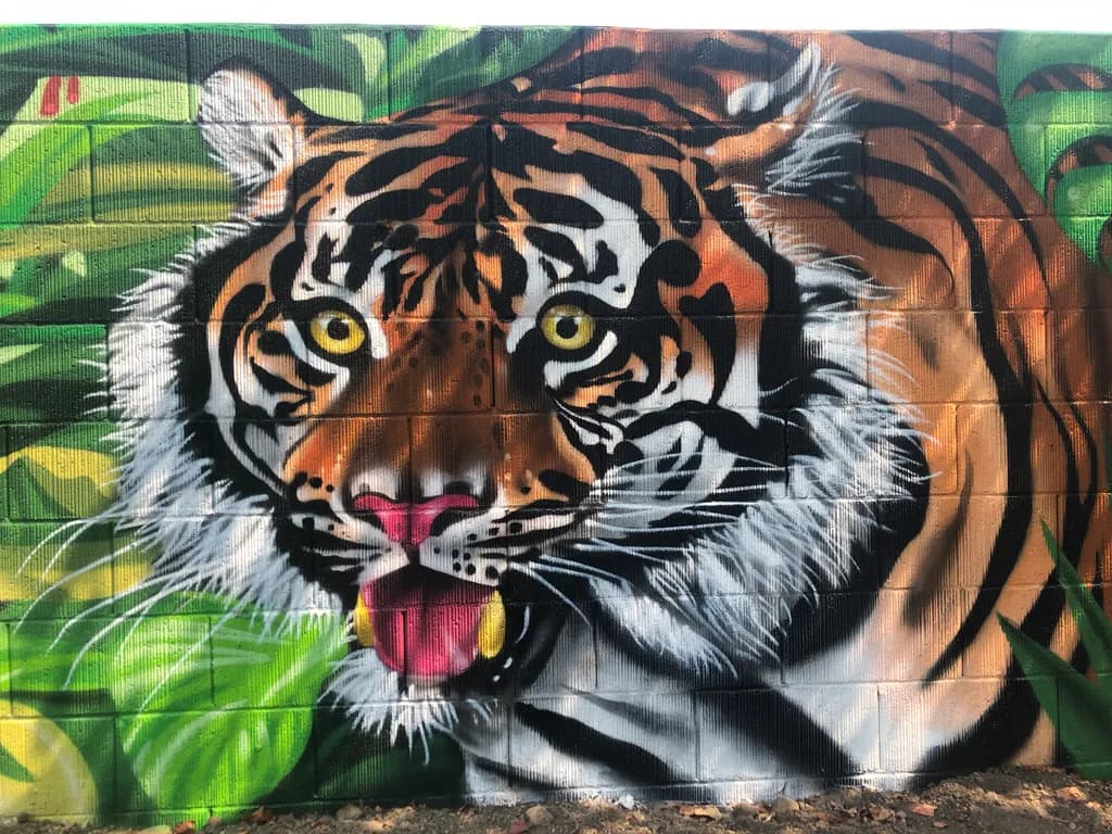 Majestic Roar: A Vibrant Tiger Mural Capturing Nature's Power and Beauty